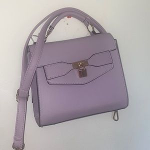 Nice hand bag. Or comes with a strap.